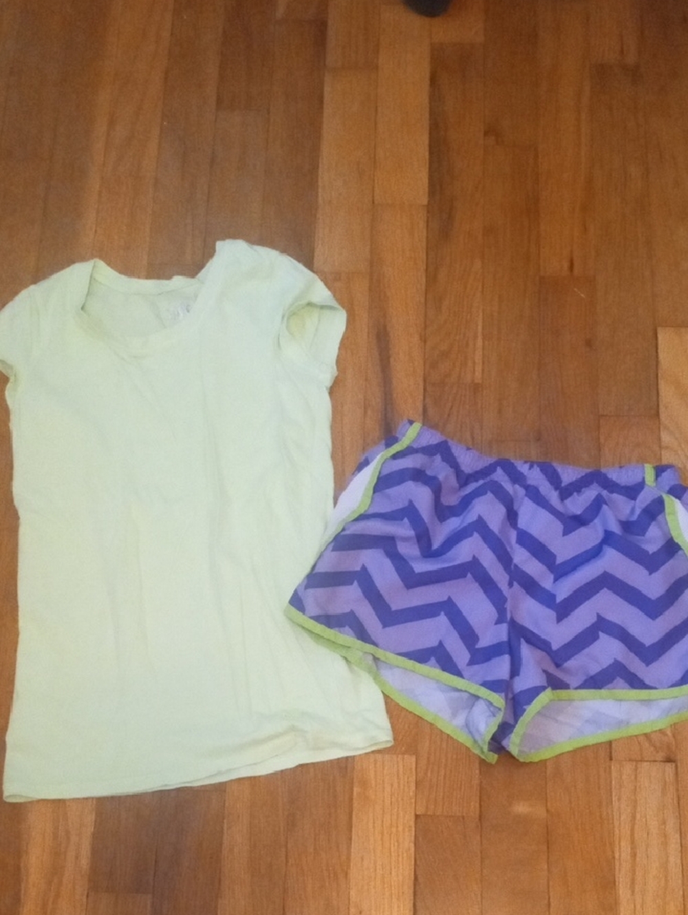 girl large champion shorts and bright green tee